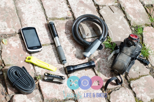 Picture of Garmin, inner tube, bicycle pump, cycling lights, cycling lock and multi tool